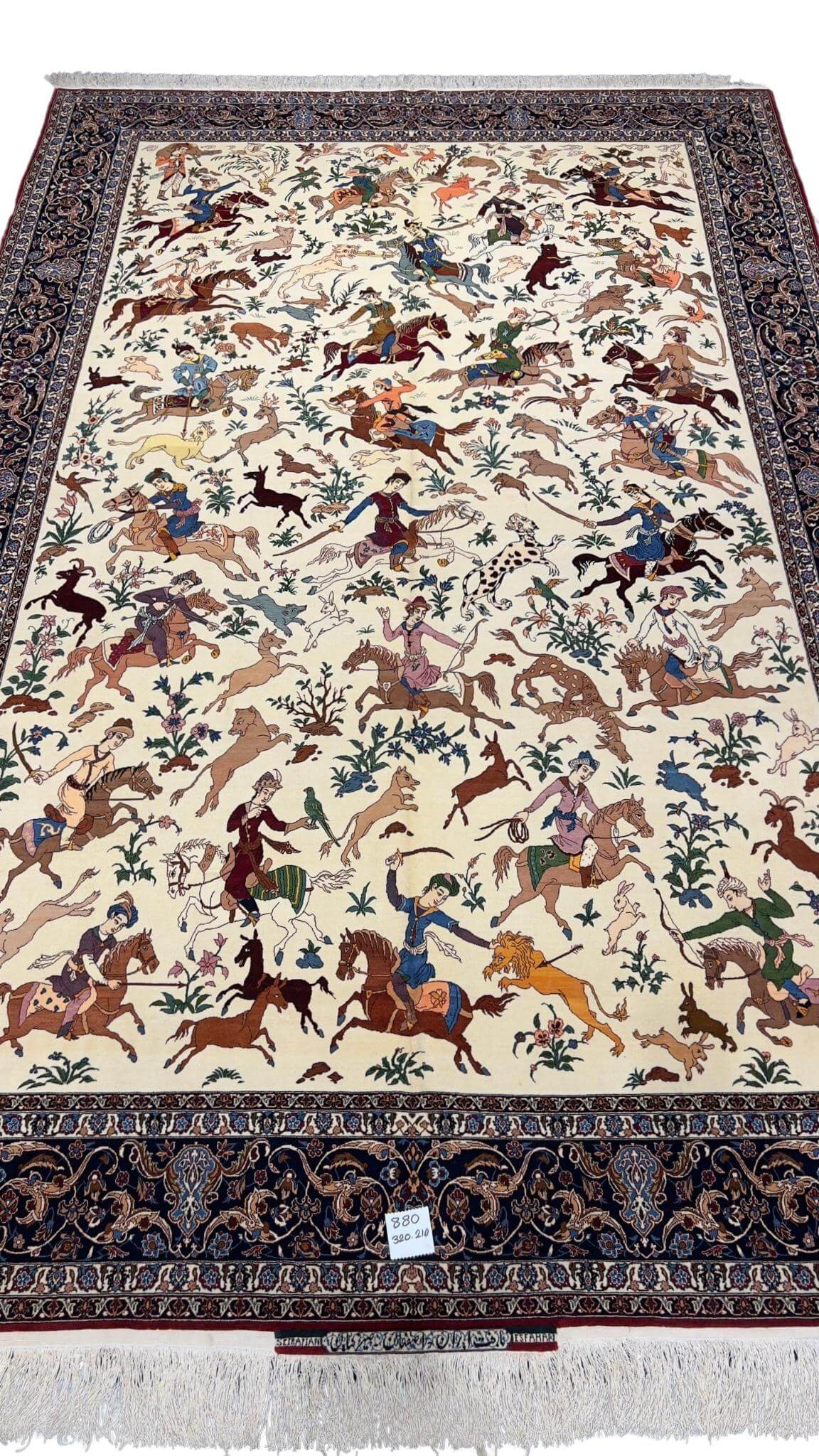 "Cream background Persian rug featuring vibrant hunting motifs and horseback riders."